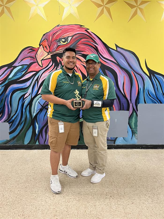 Coach Salas and Coach Glenn with the championship trophy